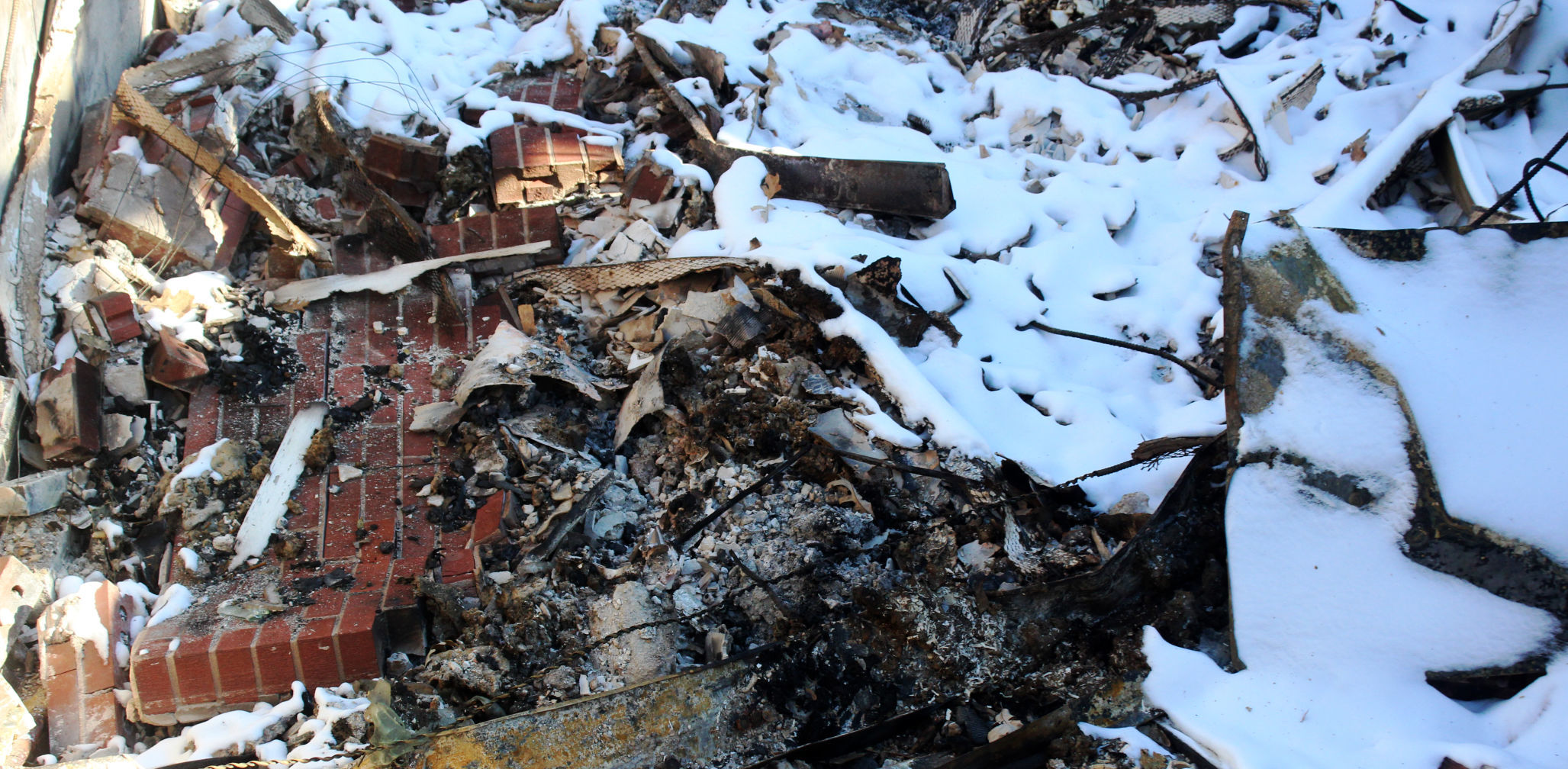 Ash and brick fallen into what had been the basement